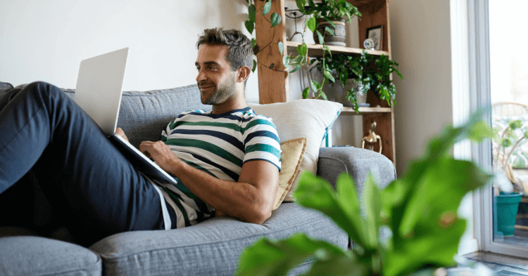 Man on the couch with his laptop